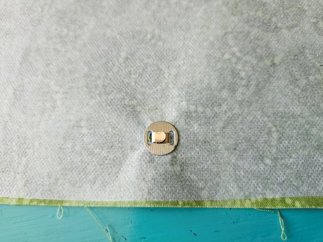 Place the washer on the prongs and press down the prongs