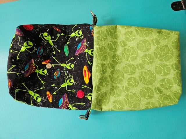 Turn the crossbody messenger bag right side out