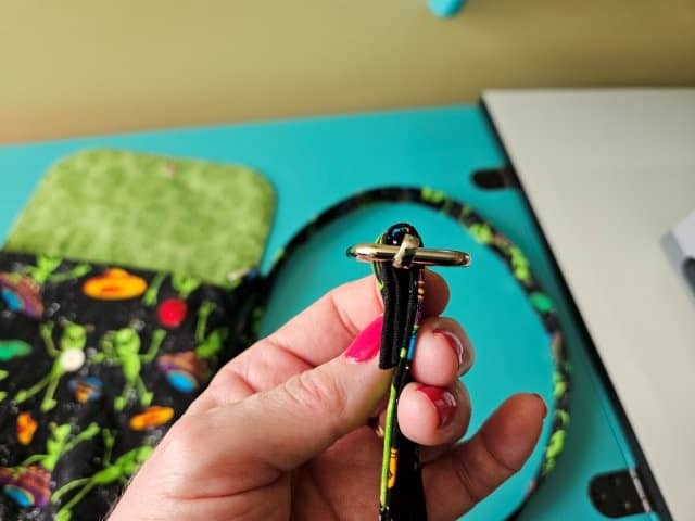 Slide the strap through the rectangle slide and fold over