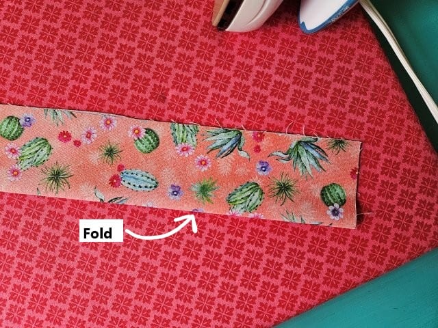 Fold the strap in half lengthwise
