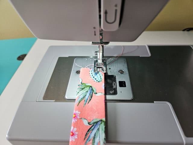 Sew both sides of the strap lengthwise