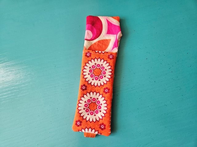Turn the bookmark pen holder right side out