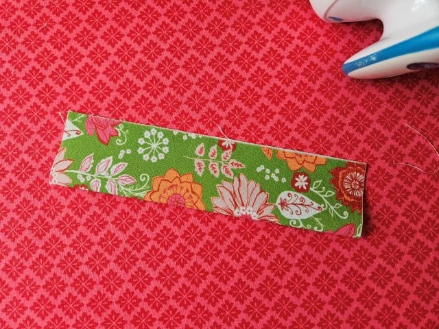 Fold the strap in half lengthwise