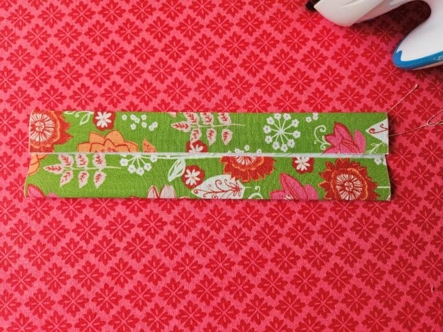 Fold other side of the strap to the center