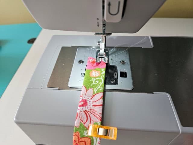 Sew the strap along both long edges