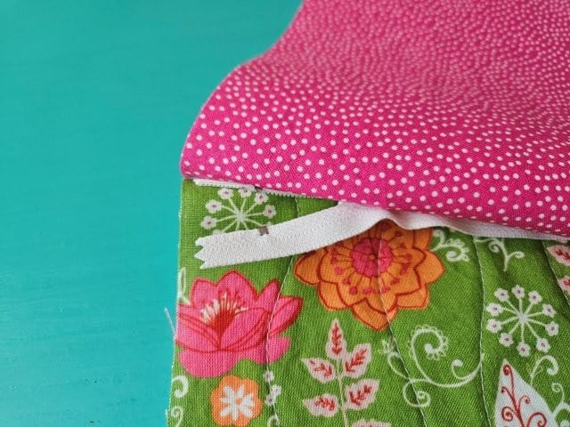Open zipper about an inch