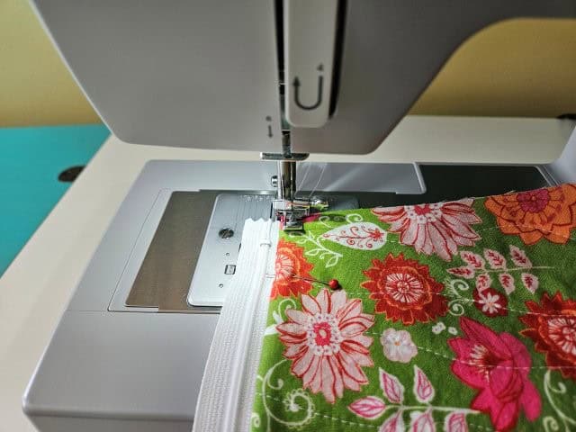 Top stitch along the zipper