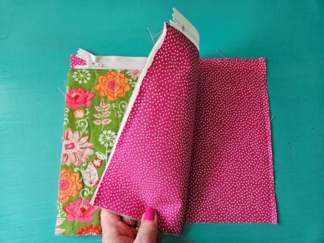 Place zipper on top of the other lining fabric piece