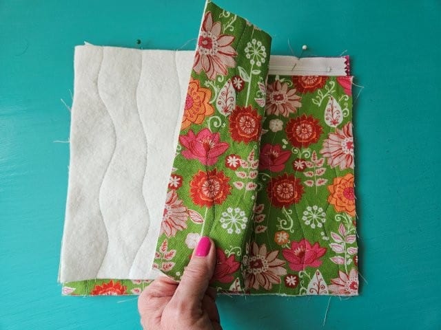 Place the other outer fabric piece on top of the zipper