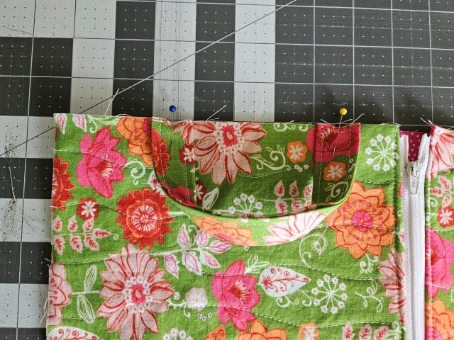 Place the strap on the side of the outer fabric piece