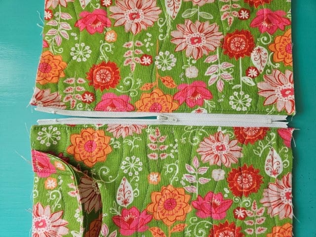 Open the zipper halfway