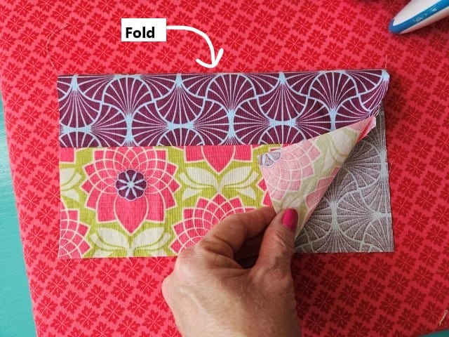 Fold the side pocket in half and press the fold