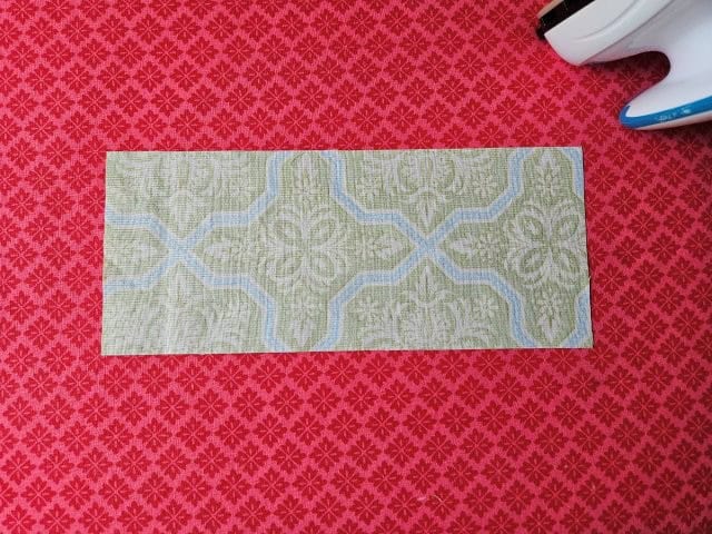 Place accent piece wrong side up on ironing board
