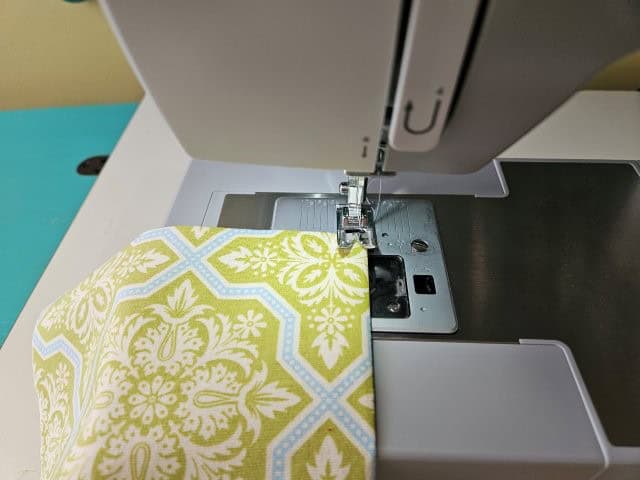 Top stitch along the top of the notepad pocket