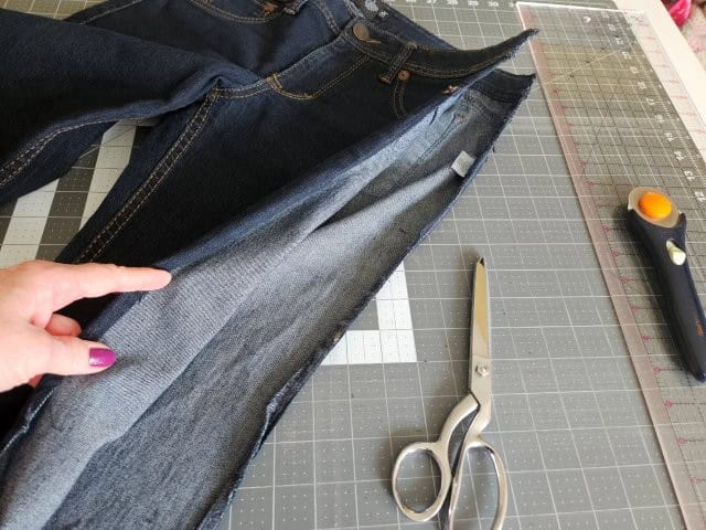 Cut the outside seams of the jeans