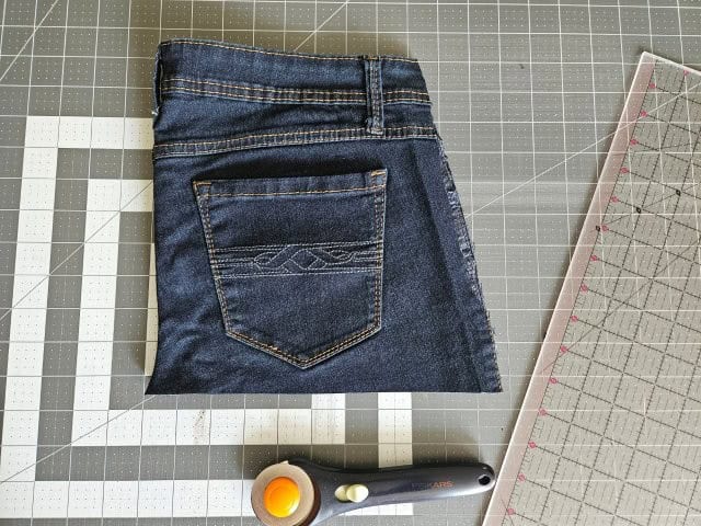 Cut along the bottom of the jeans