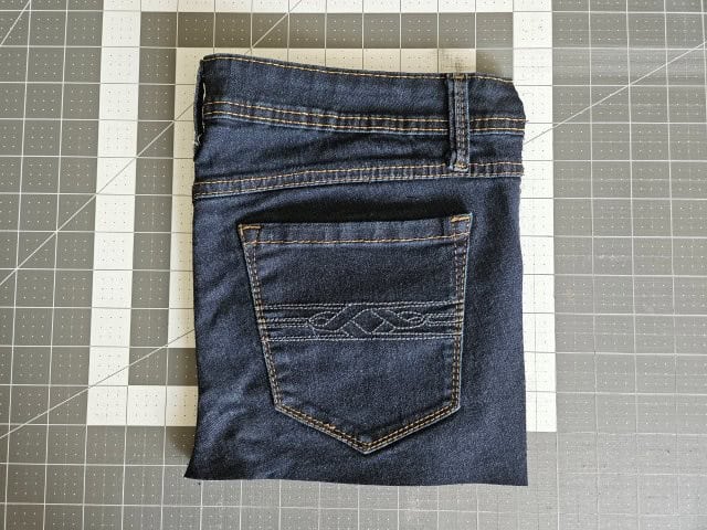 Picture of the excess of the jeans cut off to make straight edge