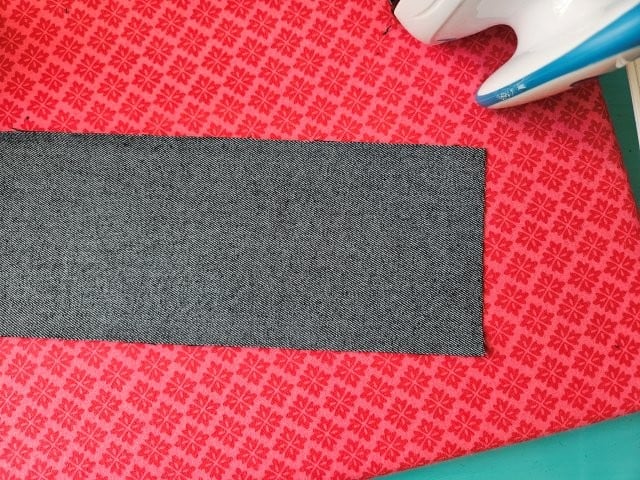 Place strap wrong side up on ironing board
