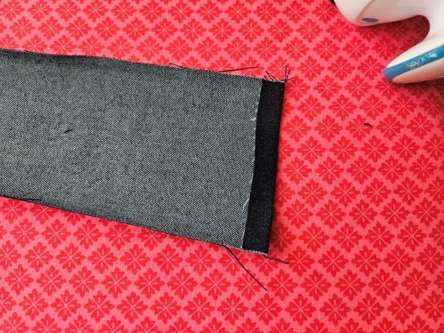Open the strap back up and fold the short edge to hem