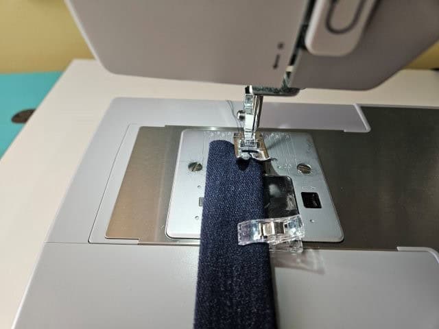 Sew along each edge of the strap lengthwise