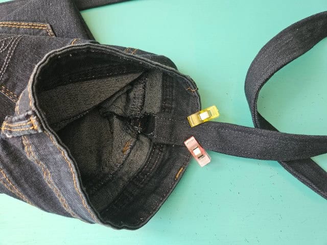 Place the strap in the center of the seam on the inside of the bag