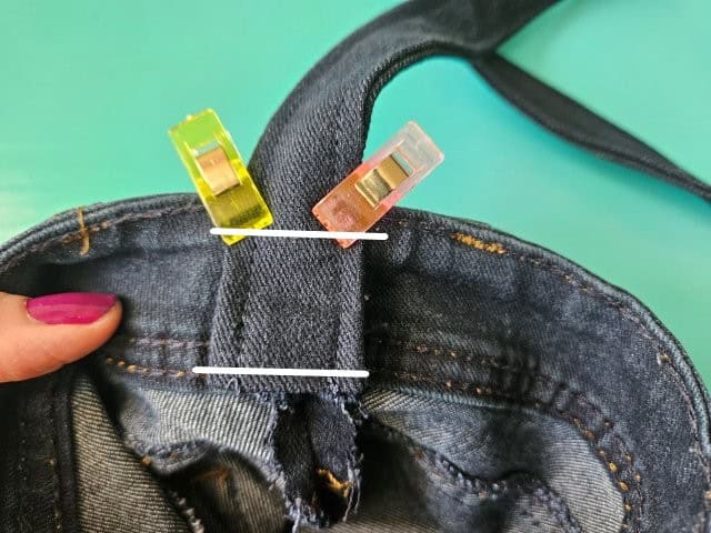 Sew the bottom of the strap to the bag