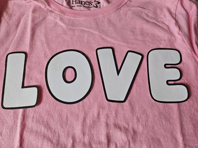 Place the letters on the shirt to check size