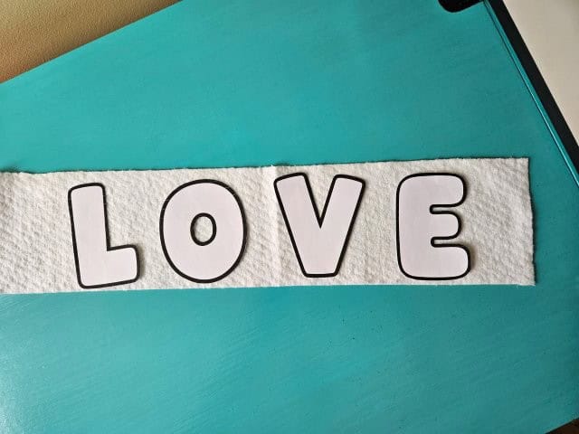 Cut out letters and place on cotton batting