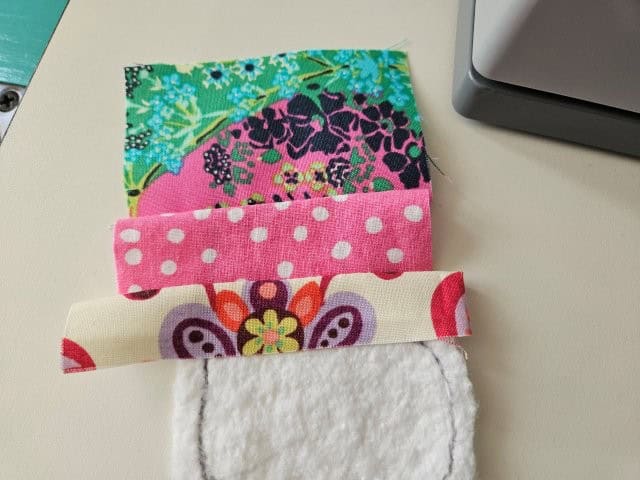 Third fabric piece sewn and finger pressed