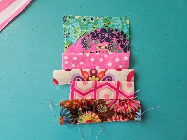 Fabric scraps sewn to the letter L