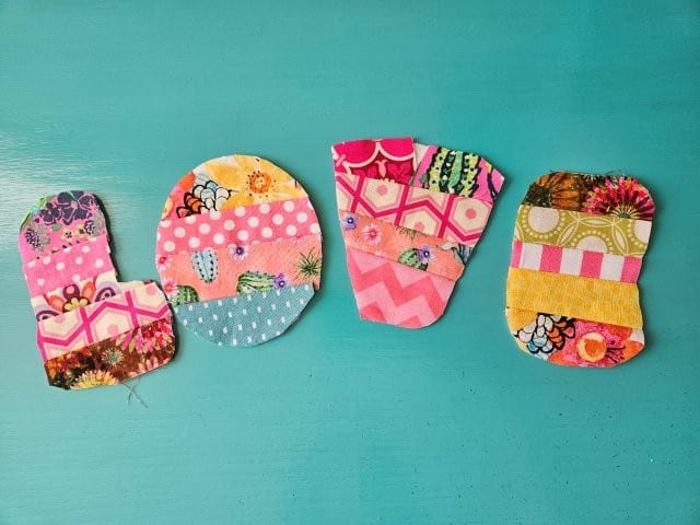 Trim all the excess fabric around the patchwork letters