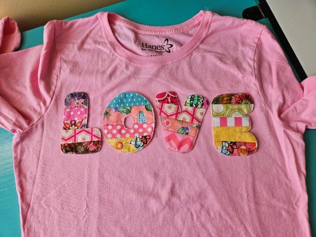 Place the letters on the front of the shirt