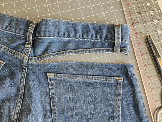 Cut just below the stitching above the pocket