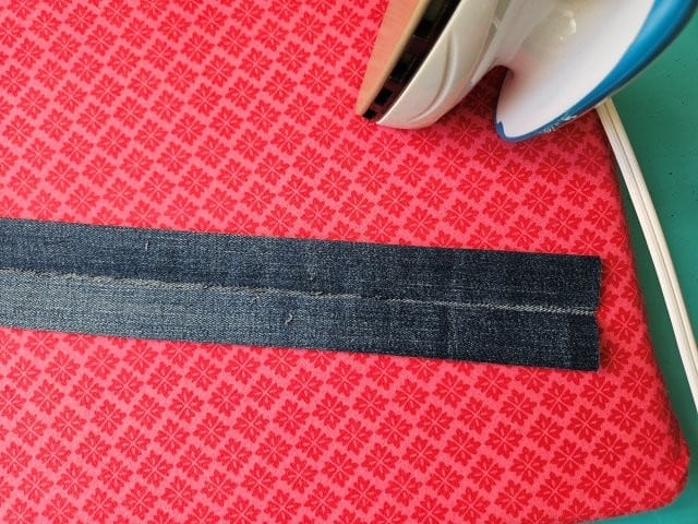 Fold the other side of the strap to center and press