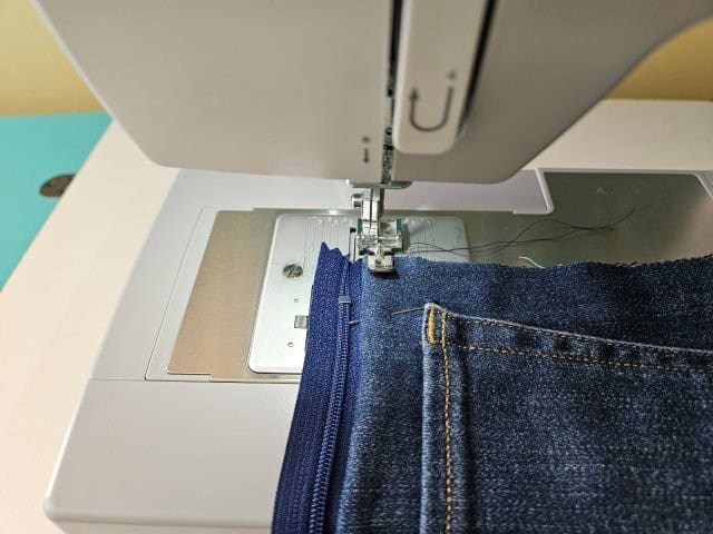 Top stitch along the zipper