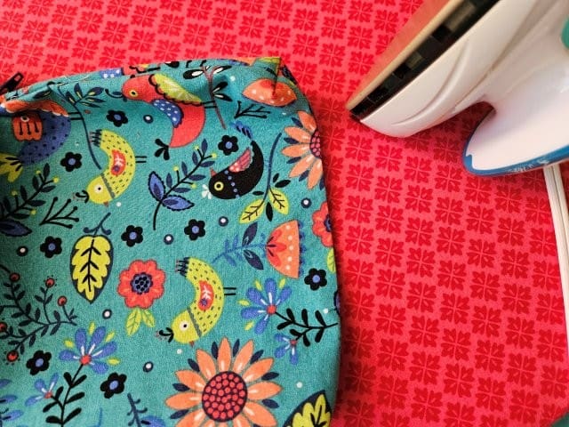 Press the opening in the wristlet lining