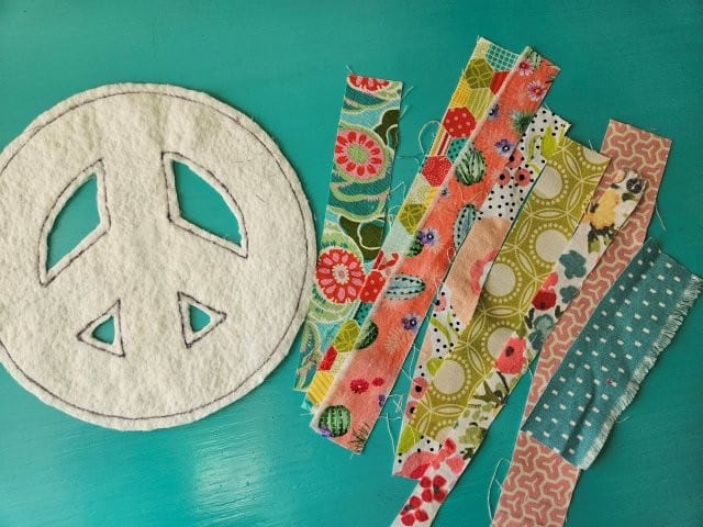 Peace sign and strips of fabric scraps