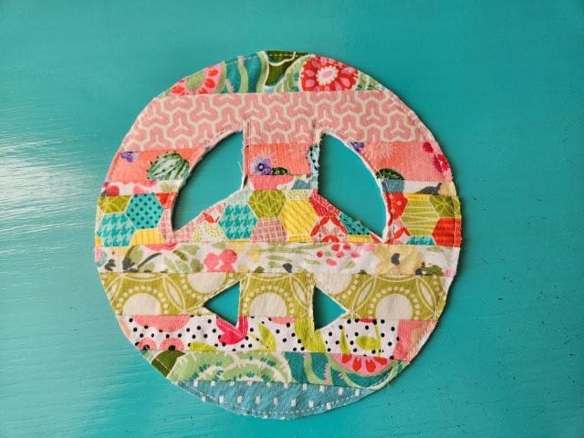 Trim around the peace sign including the middle